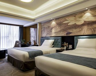 Shishi Wanjia International Hotel - קואנג'ואו - חדר שינה