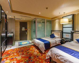Friday Holiday Hotel (Jiaozuo Xinfeng Er Street) - Jiaozuo - Schlafzimmer
