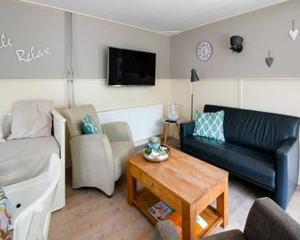 Holiday home in surroundings nearby the coast - 't Zand - Living room