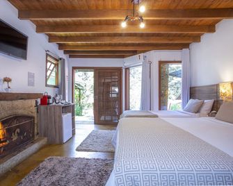 Pousada Suica Mineira Garden - Monte Verde - Schlafzimmer