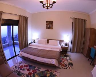 The Hotel Suit with Breathtaking Coast View and Balcony - Miziara - Bedroom