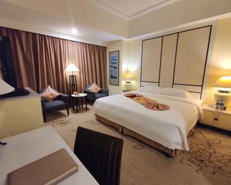 Hainan Junhua Haiyi Hotel - Haikou - Habitación