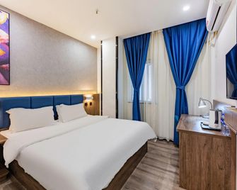 7 Days Premium Hotel (Shijiazhuang Donggang Road Dashimen) - Shijiazhuang - Habitación