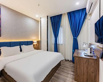 7 Days Premium Hotel (Shijiazhuang Donggang Road Dashimen) - Shijiazhuang - Bedroom