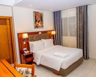 Geneva Hotel - דואלה - חדר שינה