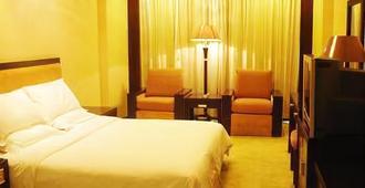 Dongya Business Hotel - Quanzhou - Schlafzimmer