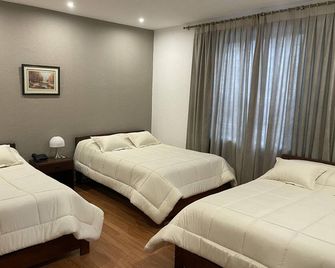 Alston Inn Hotel - Quito - Slaapkamer