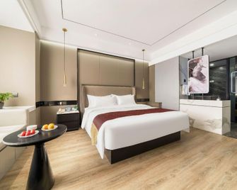 Guangming Hotel - جيوتشيوان - غرفة نوم