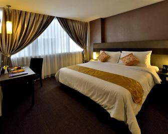 Tjokro Hotel Pekanbaru - Pekanbaru - Slaapkamer