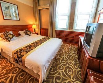Chang Bai Shan Hotel - Baishan - Slaapkamer