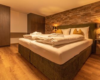 Tevini Boutique Suites by we rent - Zell am See - Schlafzimmer