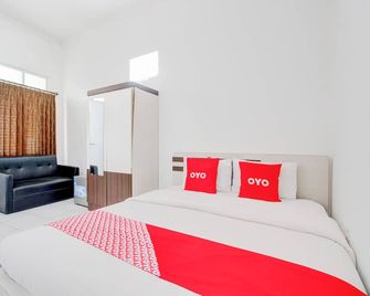 RedDoorz Syariah @ Wisma Arya 2 - Yogyakarta - Schlafzimmer