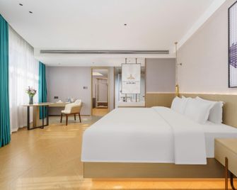 Hailan Holiday Hotel (Urumqi Medical College Branch) - Ürümqi - Schlafzimmer