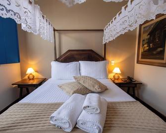 بوسادا سولار دا إنكونفيدينسيا - أورو بريتو - غرفة نوم