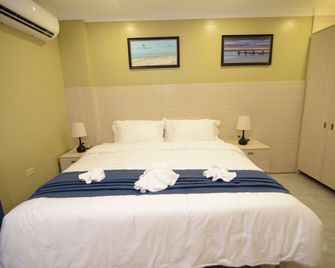 The Caye Hotel Caye Caulker - Caye Caulker - Schlafzimmer