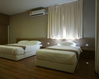 Yew Hotel - Miri - Slaapkamer