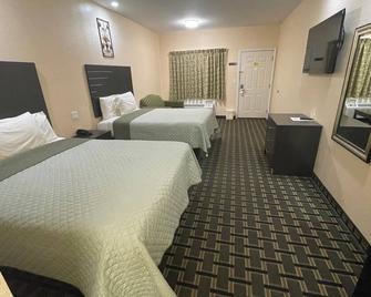 Homegate Inn & Suites West Memphis - West Memphis - Bedroom