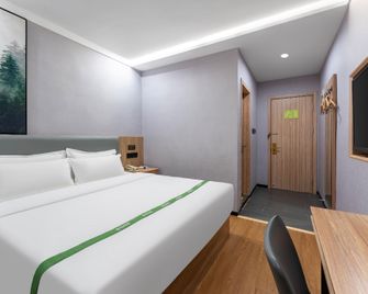 Green Tree Inn Jinan Zhangqiu University Town Commercial Street - Jinan - Camera da letto