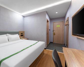 Green Tree Inn Jinan Zhangqiu University Town Commercial Street - Jinan - Bedroom