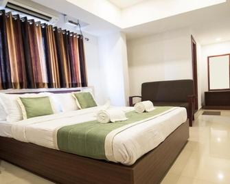 Puthens Capitol Inn - Kochi - Schlafzimmer