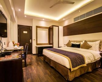 Hotel Grand Godwin - ניו דלהי - חדר שינה