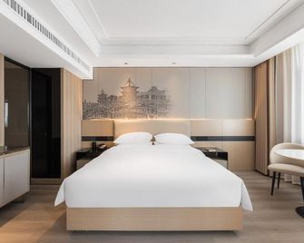Xiangyang Langman City Hotel - Xiangyang - Bedroom