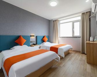 7Days Inn Tianjin Binhai New District Government - Tianjin - Slaapkamer