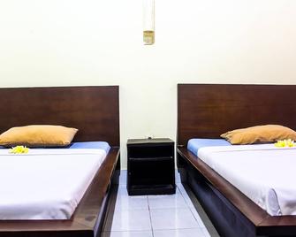 Budhi beach inn - Kuta - Camera da letto