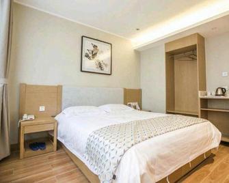 Huayang Hotel - Tangshan - Bedroom