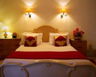 Pleasant Stay Guest House - Madrás - Habitación
