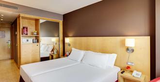 Hotel Sercotel Portales - לוגרונו - חדר שינה