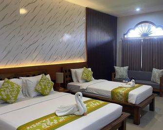 ثري براذرز بنجالوز آند فيلاز - كوتا - غرفة نوم