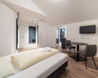 Appartements zur Sonne - نيوستيفت ام ستوبايتال - غرفة نوم