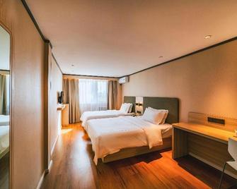 Hanting Hotel Qingdao Shandong Road Central Business District - Qingdao - Schlafzimmer