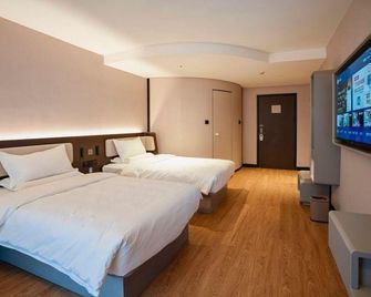 Hanting Hotel Tianjin Italian Style Street - Tianjín - Habitación