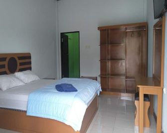 Hotel O Pondok Puti Sartika Syariahnearpasar Jum'at Aluh Aluh - Banjarmasin - Ložnice