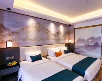 وينزو إنرناشونال هوتل - ونزهو - غرفة نوم