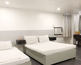 Acme Inn Subic - Olongapo - Спальня