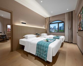 Haojing Garden Hotel (Lianyungang Suning Plaza Pedestrian Street) - Lianyungang - Bedroom