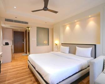 Hotel Square 36 - Kota - Slaapkamer