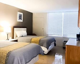 Apm Inn & Suites - Martinsburg - Schlafzimmer