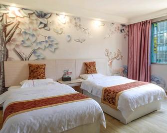Gujia Express Hotel - Qiannan - Bedroom