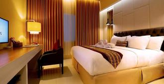 G'Sign Hotel Banjarmasin - Banjarmasin - Slaapkamer
