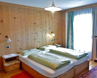 Hotel Garnì al Plan - ליביניו - חדר שינה