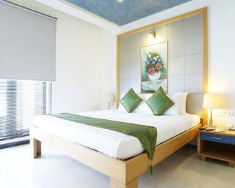 Treebo Edha Suites Koramangala - Bengaluru - Bedroom