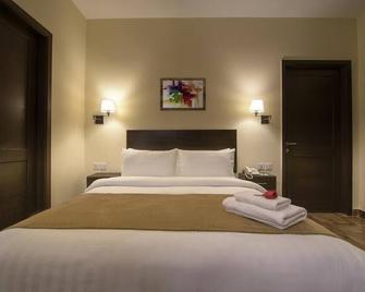 Hotel One Sahiwal - Sahiwal - Camera da letto
