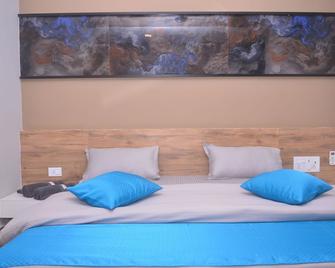 Hotel Radhe Inn - Una - Bedroom