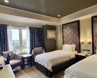 Mo2 Westown Hotel Iloilo - אילוילו סיטי - חדר שינה