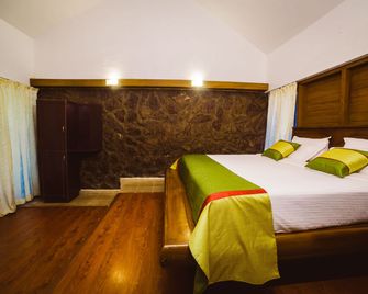 Deep Woods Resort - מונאר - חדר שינה