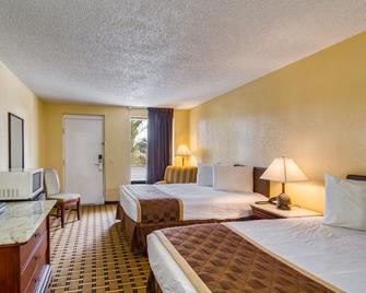Palms Garden Inn - Lake City - Schlafzimmer